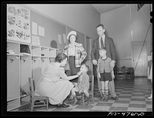 Queens, New York. Nursery school at the Queensbridge housing project. Parents bring their children to the nursery in the morning