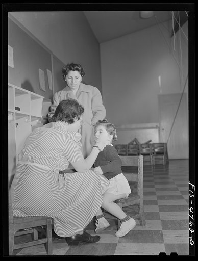 Queens, New York. Nursery school at the Queensbridge housing project. Children are examined each morning when they are admitted to the nursery