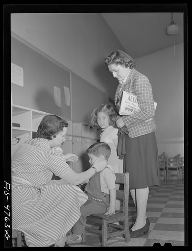 Untitled photo, possibly related to: Queens, New York. Nursery school at the Queensbridge housing project. Children are examined each morning when they are admitted to the nursery