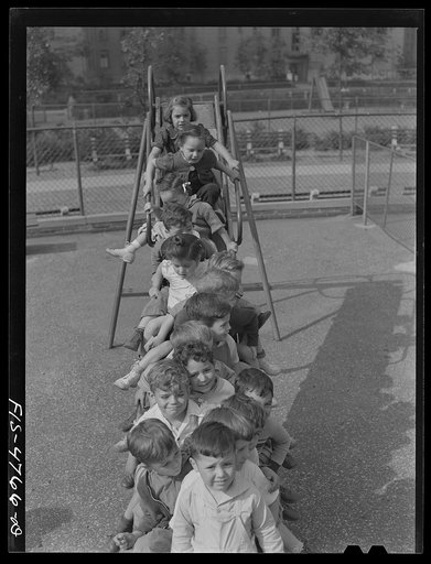 Untitled photo, possibly related to: Queens, New York. Nursery school at the Queensbridge housing project. Children on a slide