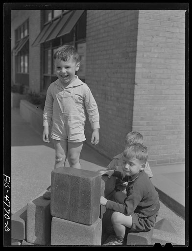Untitled photo, possibly related to: Queens, New York. Child with blocks at the nursery school at Queensbridge housing project