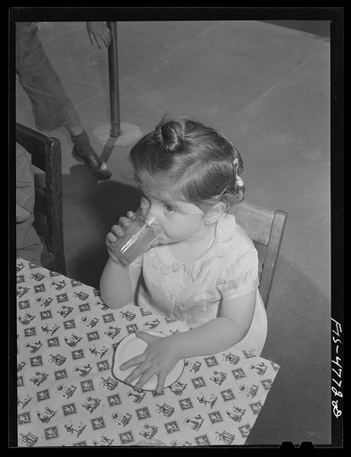 Queens, New York. Nursery school at the Queensbridge housing project. Drinking milk