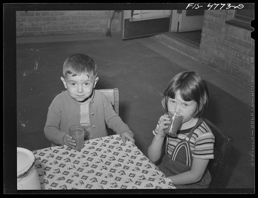 Queens, New York. Nursery school at the Queensbridge housing project. Drinking tomato juice