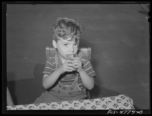 Queens, New York. Nursery school at the Queensbridge housing project. Drinking tomato juice