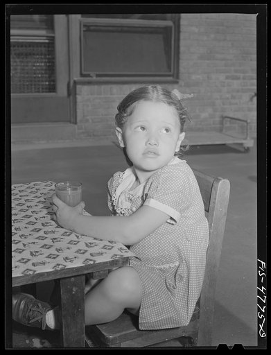 Queens, New York. Nursery school at the Queensbridge housing project. Drinking tomato juice