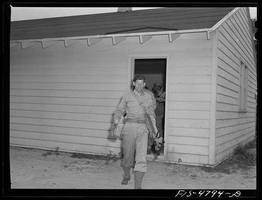 Edgewood Arsenal, Maryland. Gas demonstration. Soldiers leaving gas chamber filled with tear gas after they had removed gas masks just before coming out