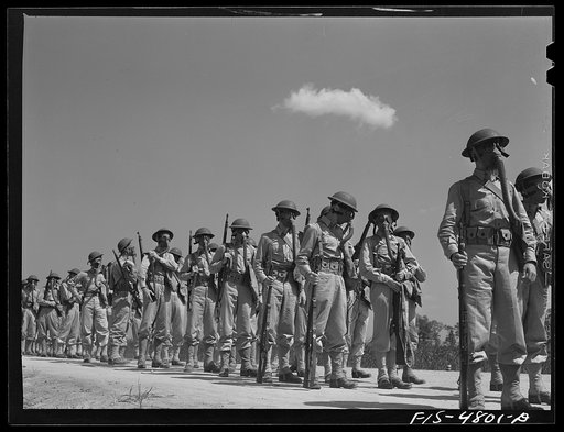 Edgewood Arsenal, Maryland. Gas demonstration. Soldiers wearing gas masks after having been sprayed with gas from a plane