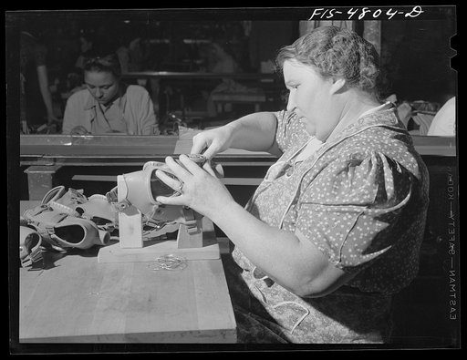 Edgewood Arsenal, Maryland. Gas demonstration. Working on reconditioned gas masks for civilian defense use at the gas mask factory