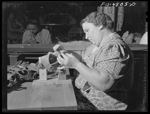 Untitled photo, possibly related to: Edgewood Arsenal, Maryland. Gas demonstration. Working on reconditioned gas masks for civilian defense use at the gas mask factory