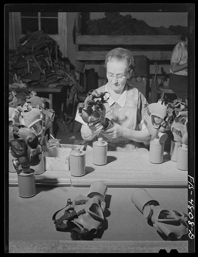 Edgewood Arsenal, Maryland. Gas demonstration. Working on reconditioned gas masks for civilian defense use at the gas mask factory