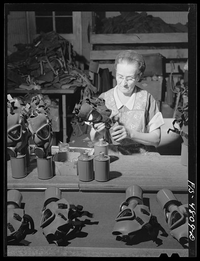 Untitled photo, possibly related to: Edgewood Arsenal, Maryland. Gas demonstration. Working on reconditioned gas masks for civilian defense use at the gas mask factory