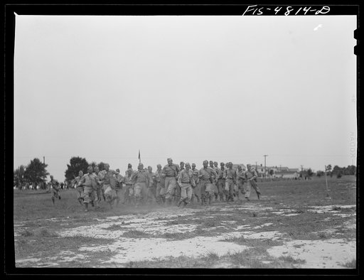 Edgewood Arsenal, Maryland. Gas demonstration. Soldiers running through a cloud of phosgene gas in order to learn its identity by odor