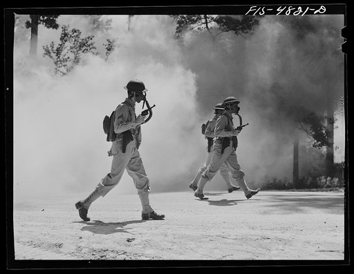 Edgewood Arsenal, Maryland. Gas demonstration. Soldiers walking through a smoke screen