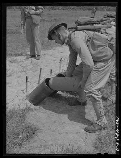 Edgewood Arsenal, Maryland. Gas demonstration. Loading a battery of Livens projectors with gas shells