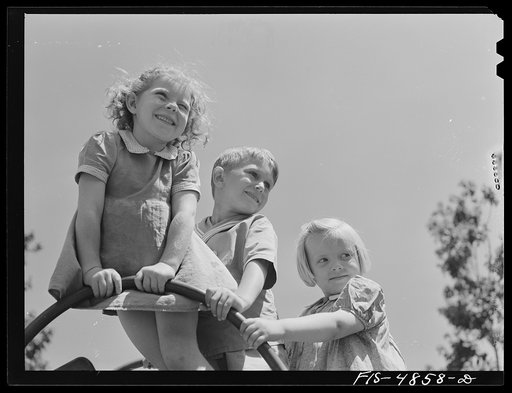 Brooklyn, New York. Red Hook housing development. Children on a slide in the kindergarten playground of the community center
