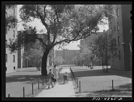 Brooklyn, New York. Red Hook housing development. Mrs. James Caputo, Jimmy and Annette walking through the project