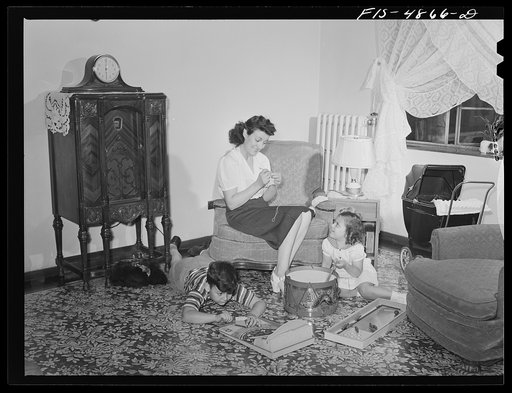Brooklyn, New York. Red Hook housing development. Mrs. Caputo and her children in the living room of their four-and-a-half room apartment for which they pay five dollars and thirty-five cents weekly