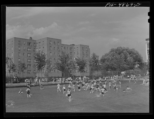 Brooklyn, New York. Red Hook housing development. Children in wading pool at play center which is supervised by the city's Department of Parks. There are separate pools for swimming and diving. Charge is nine cents for children, twenty five cents for adults