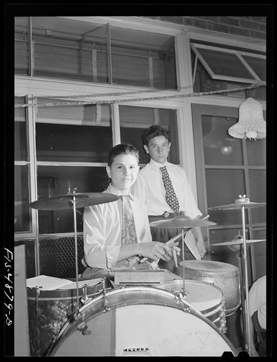 Brooklyn, New York. Red Hook housing development. Drummer in band at the community center party