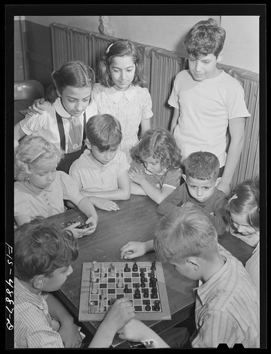 Brooklyn, New York. Red Hook housing project. Boys playing chess at the community center