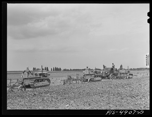 Untitled photo, possibly related to: Bridgeton, New Jersey. Seabrook Farms. Refueling tractors in the field