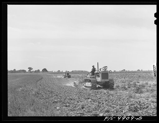 Untitled photo, possibly related to: Bridgeton, New Jersey. Seabrook Farms. Tractors ploughing on the contour