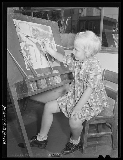 Red Hook housing project, Brooklyn, New York. Child painting in the nursery at the community center