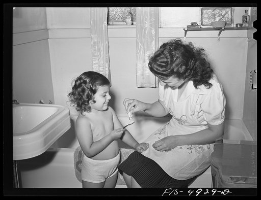 Untitled photo, possibly related to: Brooklyn, New York. Red Hook housing project. Annette Caputo brushes her teeth
