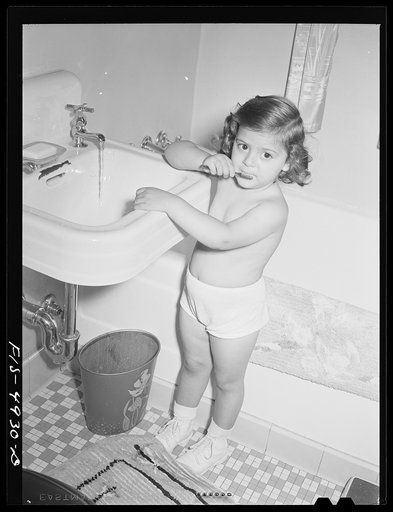 Brooklyn, New York. Red Hook housing project. Annette Caputo brushes her teeth