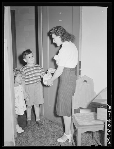 Brooklyn, New York. Red Hook housing project. Jimmy and Annette Caputo returning after having gone on an errand for their mother