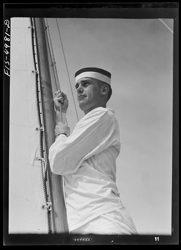 U.S. Naval Academy, Annapolis, Maryland. Midshipman hoisting a sail
