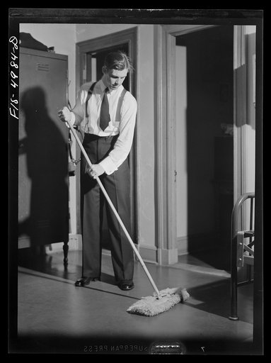 Untitled photo, possibly related to: U.S. Naval Academy, Annapolis, Maryland. Midshipman cleaning the floor of his room