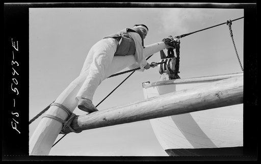 U.S. Naval Academy, Annapolis, Maryland. Midshipman lowering a boat from the davits