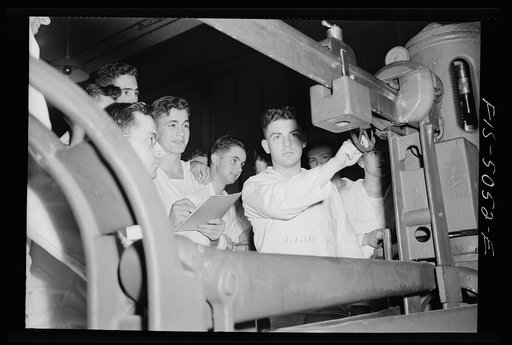 Untitled photo, possibly related to: U.S. Naval Academy, Annapolis, Maryland. Studying an engine