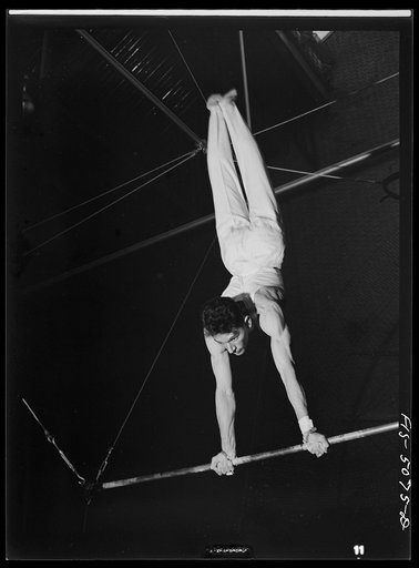 Untitled photo, possibly related to: U.S. Naval Academy, Annapolis, Maryland. Gymnast on the flying rings