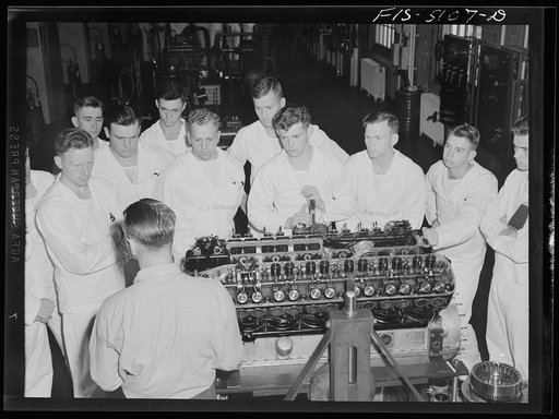 Untitled photo, possibly related to: U.S. Naval Academy, Annapolis, Maryland. Studying an auxiliary ship's engine