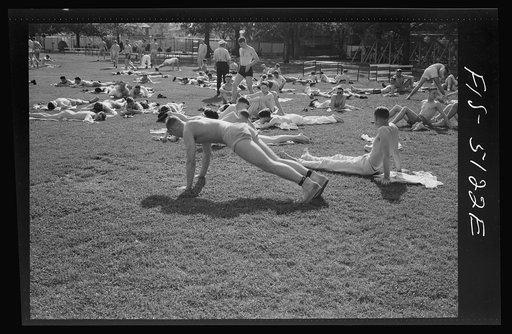 U.S. Naval Academy, Annapolis, Maryland. Midshipmen resting on the lawn
