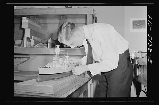 U.S. Naval Academy, Annapolis, Maryland. Midshipman studying a ship's model