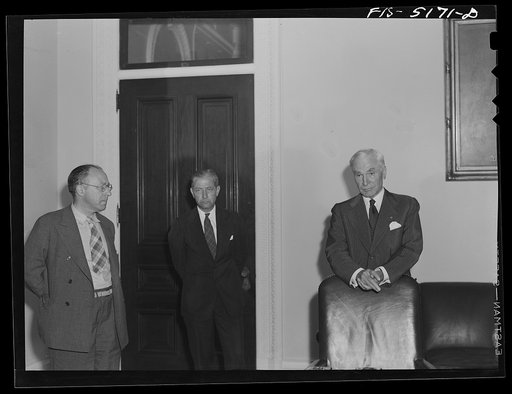 Washington, D.C. Mr. Este (left), a Swedish journalist on tour in the United States, attending Secretary Hull's press conference