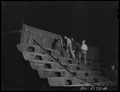 Untitled photo, possibly related to: Decatur, Alabama. Ingalls Shipbuilding Company. Work goes on twenty-four hours a day. The night shift working on the stern of one of the barges under construction