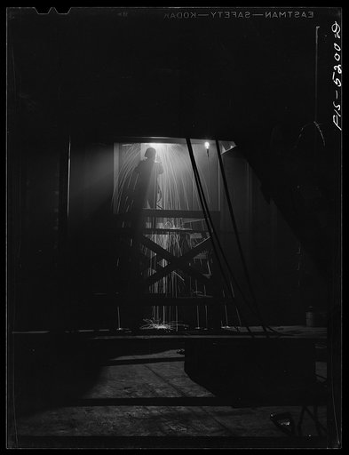 Decatur, Alabama. Ingalls Shipbuilding Company. Welding one of the bulkheads in the hold of one of the oceangoing barges