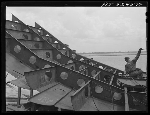 Untitled photo, possibly related to: Decatur, Alabama. Ingalls Shipbuilding Company. Welder and helper working on the stern of one of the barges
