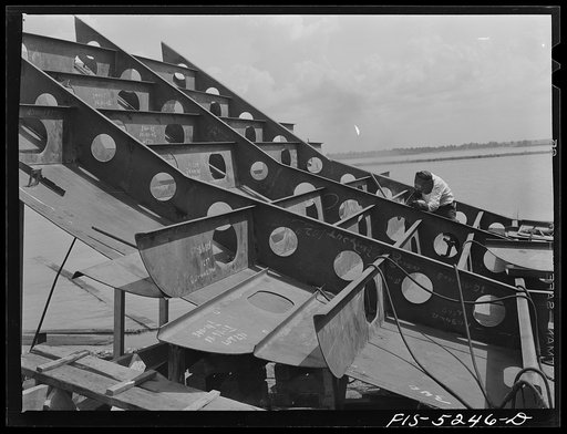 Untitled photo, possibly related to: Decatur, Alabama. Ingalls Shipbuilding Company. Welder and helper working on the stern of one of the barges