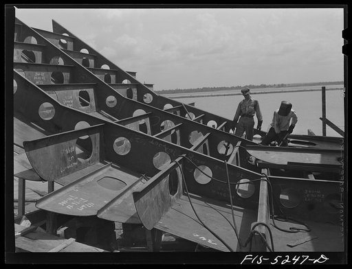 Decatur, Alabama. Ingalls Shipbuilding Company. Welder and helper working on the stern of one of the barges
