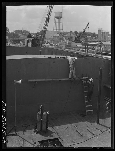 Decatur, Alabama. Ingalls Shipbuilding Company. Welding one of the bulkheads of an oceangoing barge