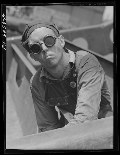 Decatur, Alabama. Ingalls Shipbuilding Company. A "tacker" working on a barge
