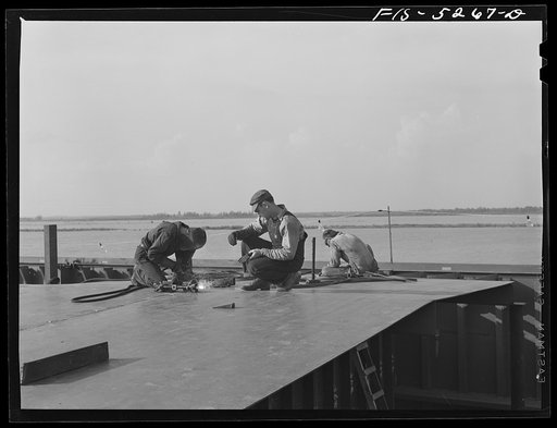 Decatur, Alabama. Ingalls Shipbuilding Company. Welding the deck of a cargo barge