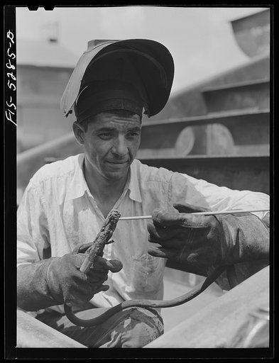 Decatur, Alabama. Ingalls Shipbuilding Company. Welder working on one of the barges