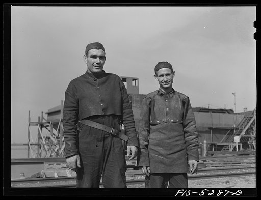 Decatur, Alabama. Ingalls Shipbuilding Company. Welder. The leather-asbestos suits are a protection for a worker in the hot, cramped double-bottoms