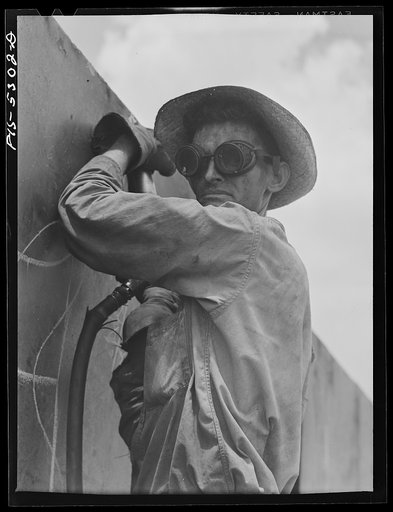 Decatur, Alabama. Ingalls Shipbuilding Company. A chipper at work on one of the barges
